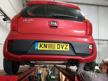 Kia Picanto has rear lenses swapped at our workshop in Murcia Kia Picanto up on workshop ramp